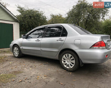 Сірий Міцубісі Lancer, об'ємом двигуна 1.58 л та пробігом 240 тис. км за 4299 $, фото 7 на Automoto.ua