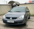 Серый Мицубиси Лансер, объемом двигателя 1.58 л и пробегом 186 тыс. км за 4700 $, фото 1 на Automoto.ua
