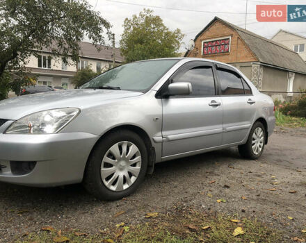 Сірий Міцубісі Lancer, об'ємом двигуна 1.58 л та пробігом 240 тис. км за 4299 $, фото 11 на Automoto.ua