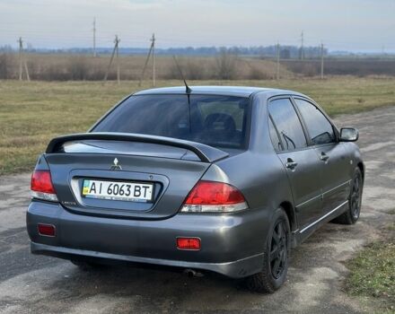 Серый Мицубиси Лансер, объемом двигателя 1.6 л и пробегом 114 тыс. км за 4000 $, фото 3 на Automoto.ua