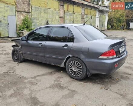 Сірий Міцубісі Lancer, об'ємом двигуна 1.58 л та пробігом 200 тис. км за 1700 $, фото 6 на Automoto.ua