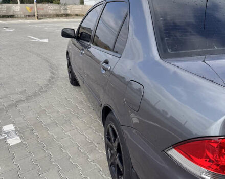 Серый Мицубиси Лансер, объемом двигателя 1.58 л и пробегом 250 тыс. км за 4300 $, фото 7 на Automoto.ua