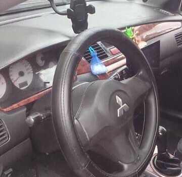 Сірий Міцубісі Lancer, об'ємом двигуна 1.58 л та пробігом 323 тис. км за 3300 $, фото 13 на Automoto.ua