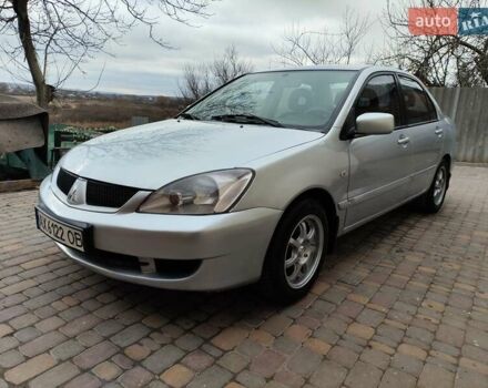 Серый Мицубиси Лансер, объемом двигателя 1.58 л и пробегом 185 тыс. км за 4700 $, фото 3 на Automoto.ua