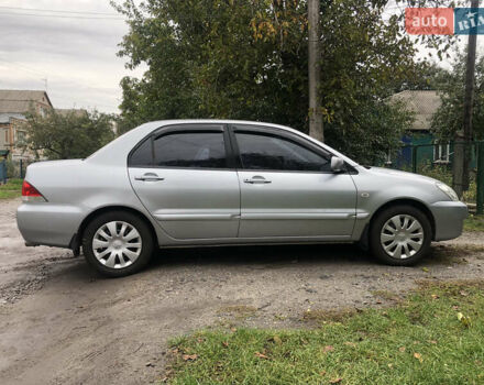 Сірий Міцубісі Lancer, об'ємом двигуна 1.58 л та пробігом 240 тис. км за 4299 $, фото 5 на Automoto.ua