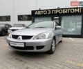 Сірий Міцубісі Lancer, об'ємом двигуна 1.6 л та пробігом 206 тис. км за 4799 $, фото 1 на Automoto.ua