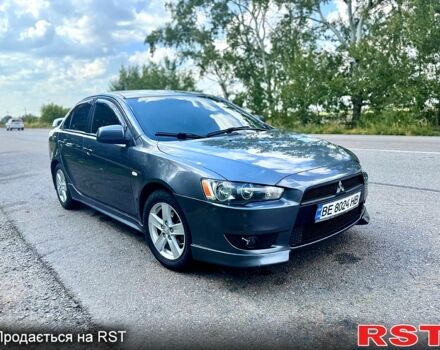 Серый Мицубиси Лансер, объемом двигателя 2 л и пробегом 250 тыс. км за 5800 $, фото 1 на Automoto.ua