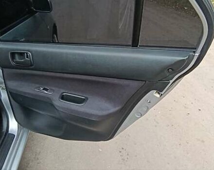 Серый Мицубиси Лансер, объемом двигателя 1.58 л и пробегом 176 тыс. км за 5000 $, фото 14 на Automoto.ua