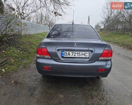 Сірий Міцубісі Lancer, об'ємом двигуна 1.58 л та пробігом 298 тис. км за 3400 $, фото 3 на Automoto.ua