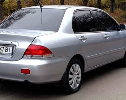 Серый Мицубиси Лансер, объемом двигателя 1.58 л и пробегом 176 тыс. км за 5000 $, фото 4 на Automoto.ua