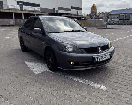 Серый Мицубиси Лансер, объемом двигателя 1.58 л и пробегом 250 тыс. км за 4300 $, фото 1 на Automoto.ua