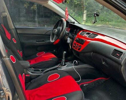 Серый Мицубиси Лансер, объемом двигателя 1.6 л и пробегом 999 тыс. км за 3200 $, фото 2 на Automoto.ua