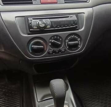 Сірий Міцубісі Lancer, об'ємом двигуна 1.6 л та пробігом 176 тис. км за 4999 $, фото 26 на Automoto.ua