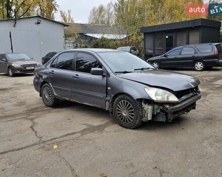 Сірий Міцубісі Lancer, об'ємом двигуна 1.58 л та пробігом 200 тис. км за 1700 $, фото 9 на Automoto.ua