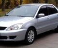 Серый Мицубиси Лансер, объемом двигателя 1.58 л и пробегом 176 тыс. км за 5000 $, фото 1 на Automoto.ua