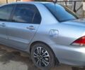 Сірий Міцубісі Lancer, об'ємом двигуна 1.6 л та пробігом 91 тис. км за 6300 $, фото 4 на Automoto.ua