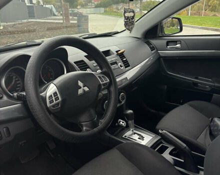 Серый Мицубиси Лансер, объемом двигателя 2 л и пробегом 211 тыс. км за 7100 $, фото 5 на Automoto.ua