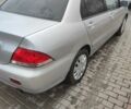 Серый Мицубиси Лансер, объемом двигателя 1.6 л и пробегом 225 тыс. км за 3100 $, фото 2 на Automoto.ua