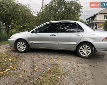 Сірий Міцубісі Lancer, об'ємом двигуна 1.58 л та пробігом 240 тис. км за 4299 $, фото 9 на Automoto.ua