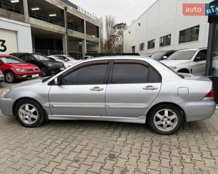 Сірий Міцубісі Lancer, об'ємом двигуна 1.6 л та пробігом 206 тис. км за 4799 $, фото 3 на Automoto.ua