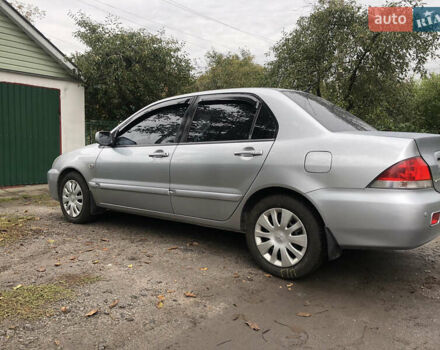 Сірий Міцубісі Lancer, об'ємом двигуна 1.58 л та пробігом 240 тис. км за 4299 $, фото 8 на Automoto.ua