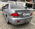 Сірий Міцубісі Lancer, об'ємом двигуна 1.6 л та пробігом 206 тис. км за 4799 $, фото 4 на Automoto.ua
