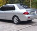 Сірий Міцубісі Lancer, об'ємом двигуна 1.6 л та пробігом 176 тис. км за 4999 $, фото 7 на Automoto.ua