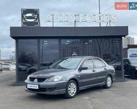 Серый Мицубиси Лансер, объемом двигателя 1.58 л и пробегом 146 тыс. км за 5490 $, фото 3 на Automoto.ua