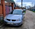 Серый Мицубиси Лансер, объемом двигателя 1.6 л и пробегом 230 тыс. км за 5000 $, фото 1 на Automoto.ua