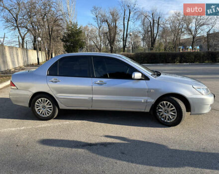 Серый Мицубиси Лансер, объемом двигателя 1.6 л и пробегом 193 тыс. км за 4000 $, фото 3 на Automoto.ua