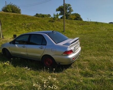 Серый Мицубиси Лансер, объемом двигателя 1.6 л и пробегом 350 тыс. км за 3600 $, фото 6 на Automoto.ua