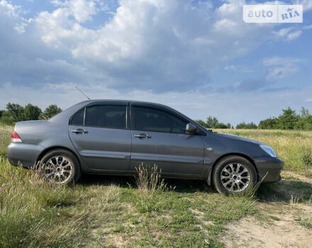 Сірий Міцубісі Lancer, об'ємом двигуна 1.6 л та пробігом 165 тис. км за 5200 $, фото 6 на Automoto.ua