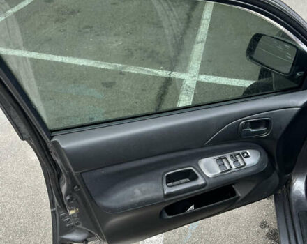 Серый Мицубиси Лансер, объемом двигателя 1.58 л и пробегом 183 тыс. км за 3800 $, фото 26 на Automoto.ua