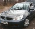 Серый Мицубиси Лансер, объемом двигателя 1.58 л и пробегом 213 тыс. км за 4200 $, фото 1 на Automoto.ua