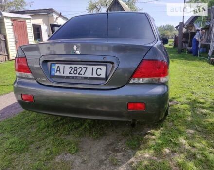 Сірий Міцубісі Lancer, об'ємом двигуна 1.58 л та пробігом 92 тис. км за 6700 $, фото 1 на Automoto.ua