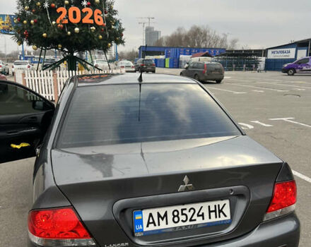 Серый Мицубиси Лансер, объемом двигателя 1.58 л и пробегом 183 тыс. км за 3800 $, фото 1 на Automoto.ua