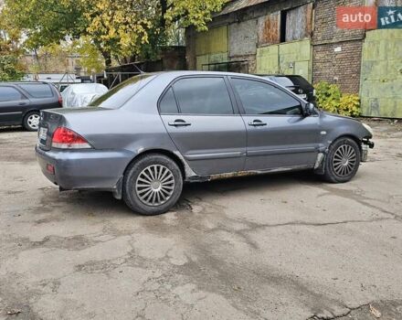 Сірий Міцубісі Lancer, об'ємом двигуна 1.58 л та пробігом 200 тис. км за 1700 $, фото 8 на Automoto.ua