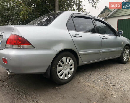 Сірий Міцубісі Lancer, об'ємом двигуна 1.58 л та пробігом 240 тис. км за 4299 $, фото 3 на Automoto.ua