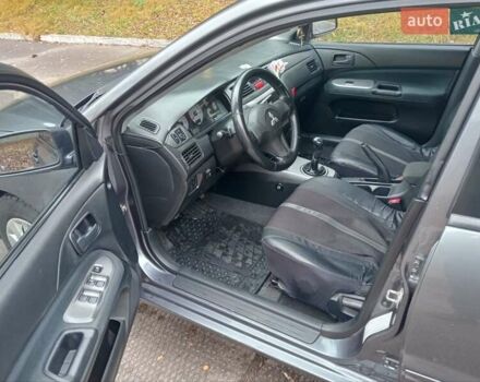 Серый Мицубиси Лансер, объемом двигателя 1.58 л и пробегом 205 тыс. км за 3300 $, фото 5 на Automoto.ua