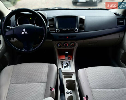 Серый Мицубиси Лансер, объемом двигателя 2 л и пробегом 212 тыс. км за 6000 $, фото 26 на Automoto.ua