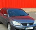 Серый Мицубиси Лансер, объемом двигателя 1.6 л и пробегом 200 тыс. км за 4550 $, фото 1 на Automoto.ua