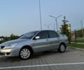 Серый Мицубиси Лансер, объемом двигателя 1.6 л и пробегом 290 тыс. км за 3818 $, фото 1 на Automoto.ua
