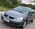 Серый Мицубиси Лансер, объемом двигателя 1.58 л и пробегом 250 тыс. км за 4200 $, фото 1 на Automoto.ua