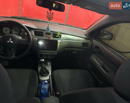 Серый Мицубиси Лансер, объемом двигателя 1.6 л и пробегом 268 тыс. км за 4600 $, фото 12 на Automoto.ua