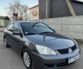 Серый Мицубиси Лансер, объемом двигателя 1.6 л и пробегом 225 тыс. км за 3350 $, фото 2 на Automoto.ua