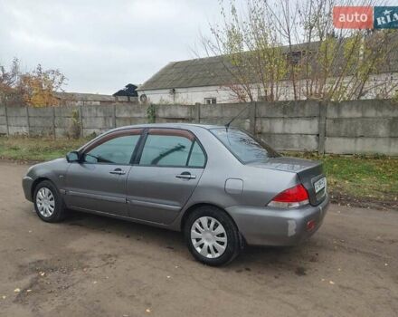 Сірий Міцубісі Lancer, об'ємом двигуна 1.58 л та пробігом 1 тис. км за 2850 $, фото 3 на Automoto.ua