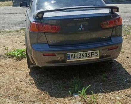 Серый Мицубиси Лансер, объемом двигателя 2 л и пробегом 77 тыс. км за 9800 $, фото 3 на Automoto.ua