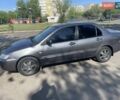 Серый Мицубиси Лансер, объемом двигателя 1.58 л и пробегом 210 тыс. км за 5000 $, фото 1 на Automoto.ua