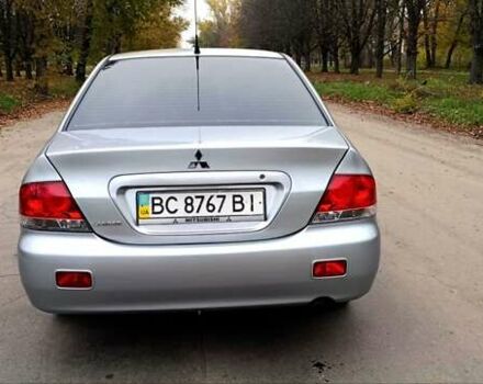 Серый Мицубиси Лансер, объемом двигателя 1.58 л и пробегом 176 тыс. км за 5000 $, фото 1 на Automoto.ua