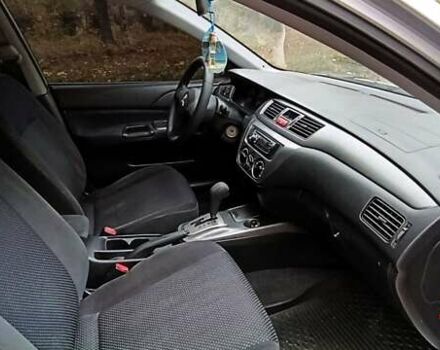 Серый Мицубиси Лансер, объемом двигателя 1.58 л и пробегом 176 тыс. км за 5000 $, фото 17 на Automoto.ua